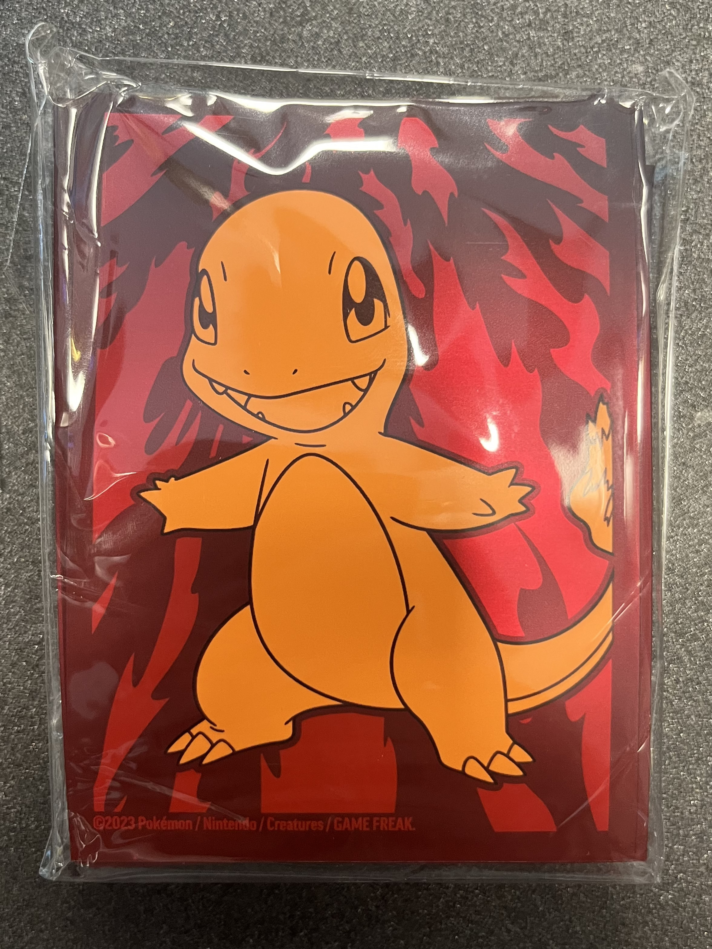 [59] Confezione 65 Sleeves ETB Obsidian Flames: Charmander